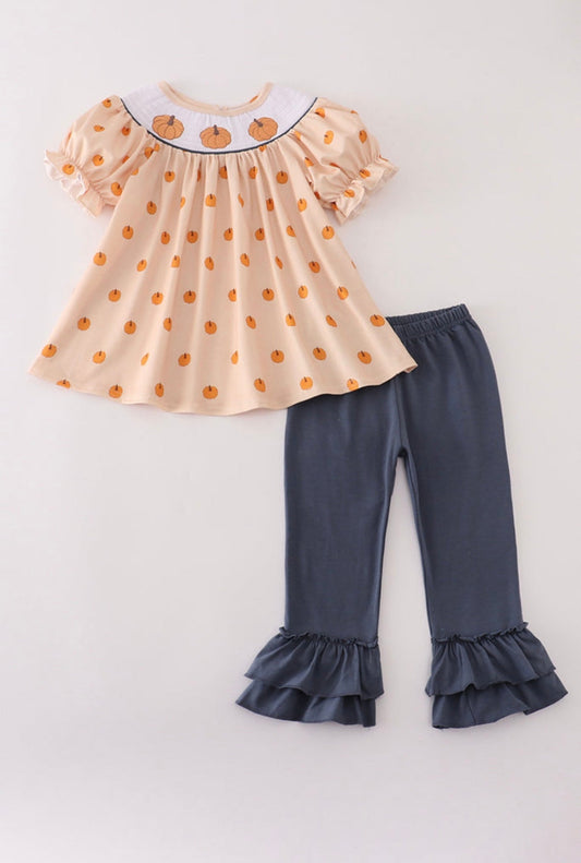Children's outfit with a top and pants on a white background